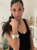 Bracciale color argento con motivo geometrico